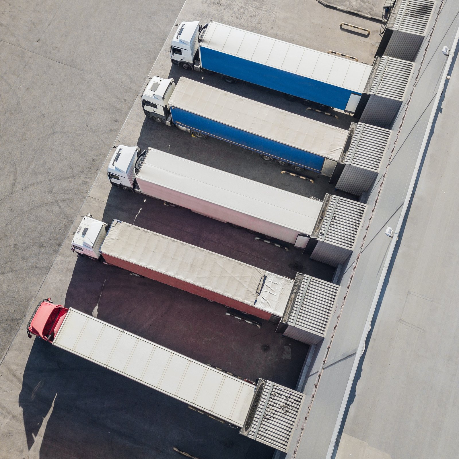 Trucks unloading in logostics center